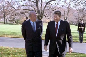 George Shultz walking with President Reagan outside the White House in December 1986.